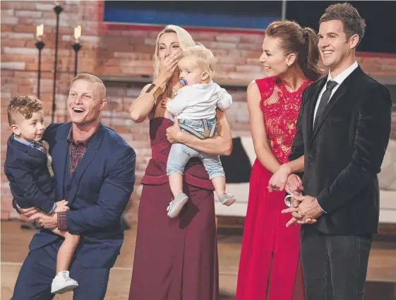  ?? Picture: CHANNEL 7 ?? Aaron and Daniella Winter celebrate with children Jackson and Brooklyn after their final win over friends Kate Whiting and James Harris (right).