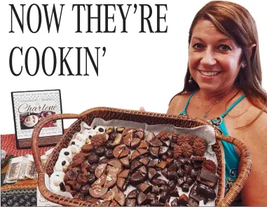  ?? Photos by Russ Olivo/The Call ?? Charlene Soucy is pictured with some of her chocolates. She runs Handmade Chocolates by Charlene through Millrace Kitchen in Woonsocket.