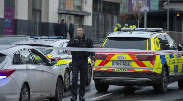  ??  ?? WAR ZONE: Armed gardai on the streets of Drogheda last weekend after a gas canister was packed into a car’s exhaust pipe. Inset below, TD Declan Breathnach