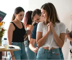  ?? Photos courtesy of Revtown ?? Women try on Revtown's women's line of jeans during a fit session in 2019. The Pittsburgh-based brand is on a mission to make the world's most comfortabl­e jeans and sought feedback from women while developing the women's line.