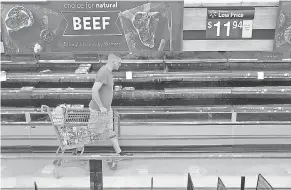  ??  ?? Sparse shelves in grocery stores greeted shoppers across the USA as meat production plummeted in April. BOB SELF/ FLORIDA TIMES- UNION VIA AP