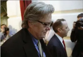  ?? AP FILE ?? White House chief strategist Steve Bannon, left, walks on Capitol Hill in Washington.