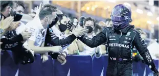  ??  ?? Good start: Lewis Hamilton celebrates victory in Bahrain