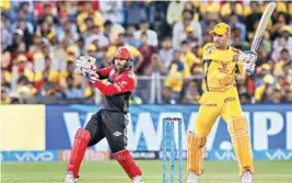  ??  ?? Chennai Super Kings’ captain MS Dhoni plays a shot against Royal Challenger­s Bangalore during an IPL cricket match in Pune on Saturday