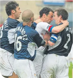  ??  ?? Muscat goes head-to-head with Dundee’s Barry Smith in 2003