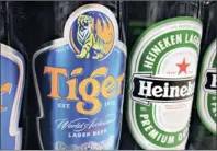  ?? PHOTO: REUTERS ?? Heineken took a major step on Tuesday towards taking full control of Asia’s Tiger beer by securing acceptance from a Thai billionair­e who had been viewed for weeks as a spoiling rival.