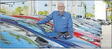  ?? [ALAN DIAZ/THE ASSOCIATED PRESS] ?? Earl Stewart, owner of a Toyota dealership, poses for a photo at his business in North Palm Beach, Fla. Stewart advises people to ignore dealer advertisin­g.