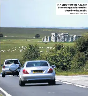  ?? Picture: Alex Davidson ?? A view from the A303 of Stonehenge as it remains
closed to the public