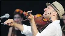  ??  ?? Chris McKhool of Sultans of String plays to an enthusiast­ic crowd in Peterborou­gh in July 9.