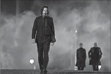 ?? MURRAY CLOSE/LIONSGATE VIA AP ?? Keanu Reeves returns as John Wick in “John Wick 4.”