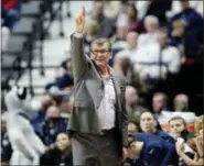  ?? JESSICA HILL — THE ASSOCIATED PRESS FILE ?? In this file photo, Connecticu­t head coach Geno Auriemma gestures to his team during the first half of an NCAA college basketball game against South Florida in the American Athletic Conference tournament finals in Uncasville, Conn. UConn finished No. 1...