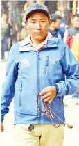  ?? — AFP photo ?? This photograph shows Kami Rita walking by the Boudhanath Stupa, where he has a rented room, on the outskirts of Kathmandu.