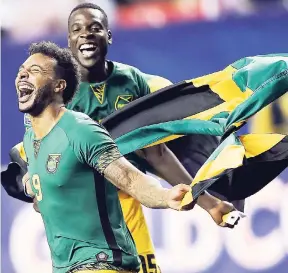  ?? FILE ?? Jamaica’s Giles Barnes (left) and Je-Vaughn Watson celebrate after Jamaica defeated the United States 2-1 in a CONCACAF Gold Cup semi-final in 2015 in Atlanta.