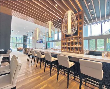  ?? HARBORWOOD URBAN KITCHEN AND BAR ?? Harborwood Urban Kitchen + Bar, specializi­ng in upscale American cuisine, is the ground-floor restaurant of the recently opened, 46-story Hyatt Centric Las Olas hotel.