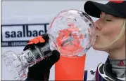  ?? AP PHOTO/ALESSANDRO TROVATI ?? United States’ Mikaela Shiffrin kisses the trophy for the alpine ski, women’s World Cup slalom discipline, in Saalbach, Austria, Saturday, March 16, 2024.