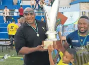  ?? Picture: SUPPLIED ?? A DASH OF BOLDNESS: East London Police coach Kauta Gqabantshi holds up the Super 12 trophy after his team beat PE Police 26-13 at Kemsley Park in Port Elizabeth at the weekend.