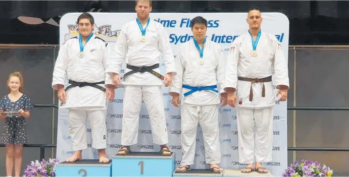  ?? Photo / Supplied ?? Whanganui’s Keightley Watson, left, with his silver medal in the Senior Men’s 100kg+ at the Sydney Judo Internatio­nal, alongside gold medal winner Liam Park.