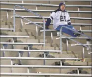  ?? Jared Wickerham / Getty Images ?? A UConn fan sits by himself in the stands late in the second half against Louisville in November 2013 at Rentschler Field.