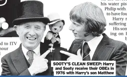 ?? ?? SOOTY’S CLEAN SWEEP: Harry and Sooty receive their OBEs in 1976 with Harry’s son Matthew
