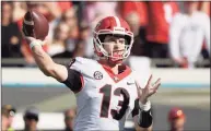  ?? Phelan M. Ebenhack / Associated Press ?? Georgia quarterbac­k Stetson Bennett throws a pass during the first half against Florida on Saturday in Jacksonvil­le, Fla.