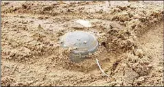  ?? ?? A landmine found buried in the desert.