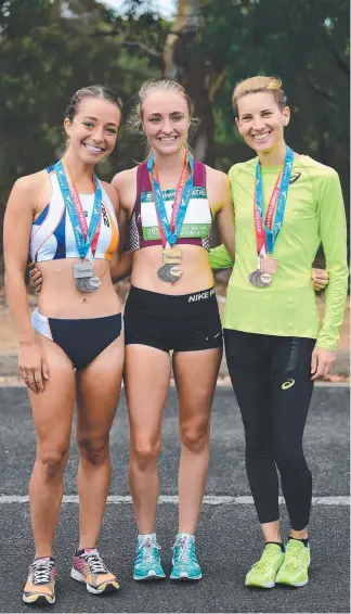  ??  ?? Katie Hayward (centre) with Jemima Montag and Claire Tallent after her 20km walk win.