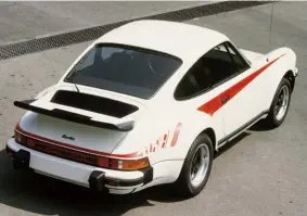  ??  ?? Below left: ʻGhostʼ graphics helped to emphasise the brutal look of the Turbo, accentuati­ng the width of the rear wings on this early production model