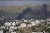  ?? NASSER NASSER — THE ASSOCIATED PRESS ?? Smoke fills the sky after Israeli settlers set fire to the properties of Palestinia­n villagers in the West Bank village of al-Mughayyir on Saturday.