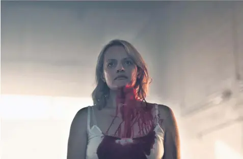  ??  ?? Fighting back: Elisabeth Moss in the second series of The Handmaid’s Tale, left; with Margaret Atwood, right