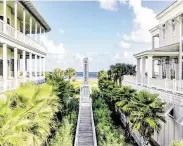  ??  ?? The tree-lined promenades and paved sidewalks inspire both residents and guests to leave their cars behind and walk or bike through the villages of Beachtown.