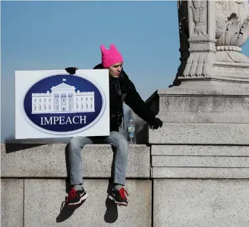  ?? (Reuters) ?? AN ANTI-TRUMP protester in Washington last year.