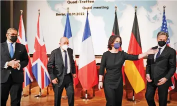  ?? — AFP ?? (L-R) Britain’s Minister of State for Middle East, North Africa and North America James Cleverly, French Foreign Minister Jean-Yves Le Drian, German Foreign Minister Annalena Baerbock and US Secretary of State Antony Blinken pose for a picture during a meeting at the German Foreign Office in Berlin on Thursday.