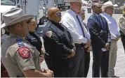  ?? DARIO LOPEZ-MILLS / AP ?? Uvalde School Police Chief Pete Arredondo (third from left) told the Texas Tribune that he intentiona­lly left behind both his police and campus radios before entering Robb Elementary School.