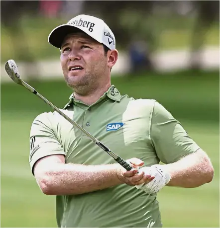  ??  ?? Off it goes: Branden Grace watches his shot on the 18th hole during the first round of the Texas Open in San Antonio on Thursday. — AP