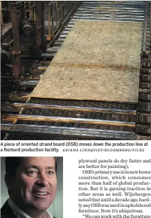  ?? ARIANA LINDQUIST/ BLOOMBERG/ FILES ?? A piece of oriented strand board (OSB) moves down the production line at a Norbord production facility.