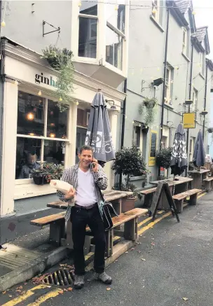  ??  ?? Llandeilo has a new free wi-fi service ahead of the Festival of the Senses. However it could become a permanent feature of the town. Pictured is the festival’s organising committee member Christoph Fischer.