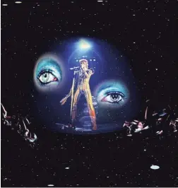  ?? PHOTOS BY TRAVIS HUTCHISON ?? “Mick Rock’s Ziggy Stardust and the Spiders From Mars” is one of three virtual-reality “films” in the Phoenix Art Museum’s “Moonage Virtual Reality” exhibit.
