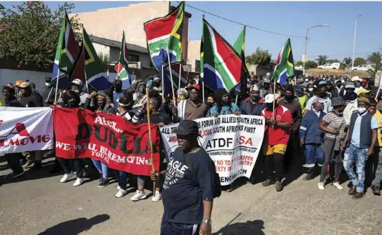  ?? ?? People march in Diepkloof as part of Operation Dudula to push migrants out of Soweto last year.