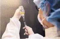  ?? TONY DEJAK/ASSOICATED PRESS ?? A pharmacy technician puts antibiotic­s into a syringe for use as an IV push at a Toledo, Ohio, hospital. A shortage of sterile fluids has led to more injections instead of IV drips.