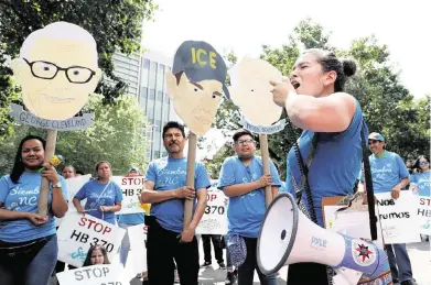  ?? ETHAN HYMAN ehyman@newsobserv­er.com ?? Nikki Marin Baena of Greensboro helps lead a chant during a 2019 rally and march in downtown Raleigh to protest bills that would have required law enforcemen­t agencies to cooperate with immigratio­n authoritie­s.