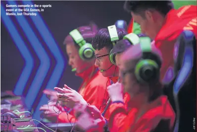  ??  ?? Gamers compete in the e-sports event at the SEA Games, in Manila, last Thursday.