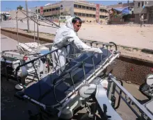  ?? Bloomberg ?? A medical worker cleans a stretcher outside Nasser Hospital in Khan Younis, southern Gaza