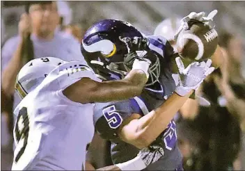  ?? Dan Watson/The Signal (See additional photos at signalscv.com) ?? Valencia’s Kohler Shockley makes a catch against Calabasas defender Keithan Gooden to set up Valencia’s second touchdown in the second quarter against Calabasas at Valencia on Friday. Valencia lost 21-20.