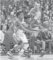  ?? Chris Sweda / Tribune News Services ?? The Rockets’ Lou Williams, left, and Sam Dekker make a human sandwich of the Bulls’ Jimmy Butler.