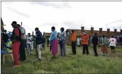  ?? BRIAN INGANGA — THE ASSOCIATED PRESS ?? Kenyans line up to receive the AstraZenec­a coronaviru­s vaccine, donated by Britain, at the Makongeni Estate in Nairobi on Saturday.