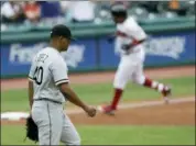  ?? TONY DEJAK — THE ASSOCIATED PRESS ?? White Sox starting pitcher Reynaldo Lopez, left, waits for the Indians’ Jose Ramirez to run the bases after Ramirez hit a three-run home run in the first inning on June 20 in Cleveland.