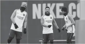  ?? — AP ?? SANT JOAN DESPI: From (left to right) FC Barcelona’s Luis Suarez, Lionel Messi and Neymar exercise during a training session at the Sports Center FC Barcelona Joan Gamper in Sant Joan Despi, Spain, yesterday FC Barcelona will play against Real Sociedad...