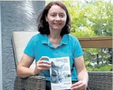  ?? LAURA BARTON/POSTMEDIA NEWS ?? Joanne Copeland, a horse trainer and riding instructor from Wainfleet, recently had a story she wrote about her cat Sabu featured in the latest Chicken Soup for the Soul book about rescued cats. In this photo she sits on the back porch of her home with...