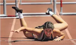  ??  ?? St. Pius’ Haley Rizek crawled to the finish line of the 2018 Girls 5A State Hurdles after clipping the last hurdle and falling just a yard short of the finish line. She finished in fourth place after leading the whole way.