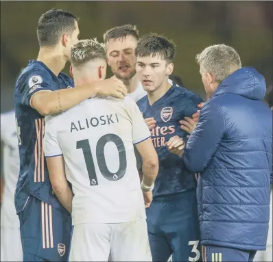  ??  ?? FLASHPOINT: Arsenal’s Kieran Tierney, right, faces up to Gjanni Alioski after the full- time whistle on Sunday over the Leeds United man’s part in Nicolas Pepe’s sending off, an incident that led to a vile reaction towards the player on social media.